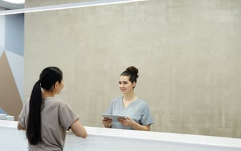 hospital receptionist and patient