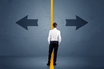 man faced with fork road