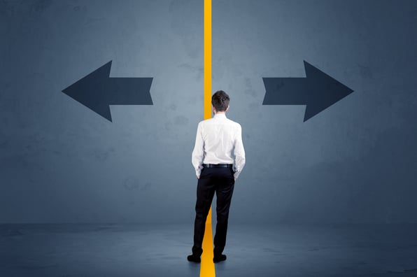 man faced with fork road