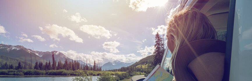 Mountain lake landscape and Young Woman in Canada