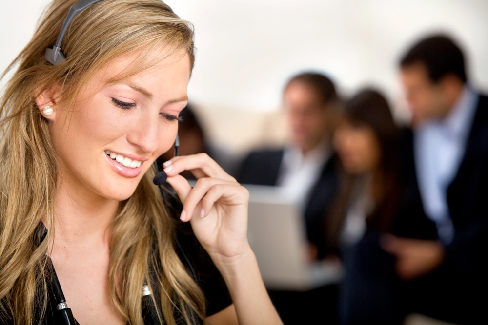 Customer support operator woman smiling at an office