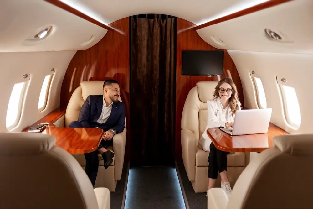 business-people-are-flying-private-luxury-plane-asian-businessman-suit-woman-manager